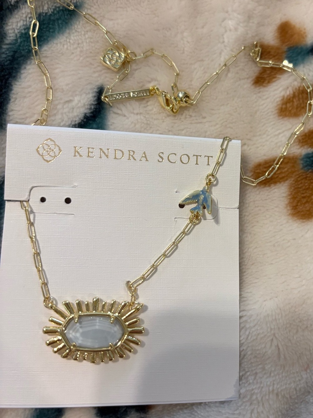 Kendra Scott Gold Necklace with White/Opalescent Sunburst Pendant